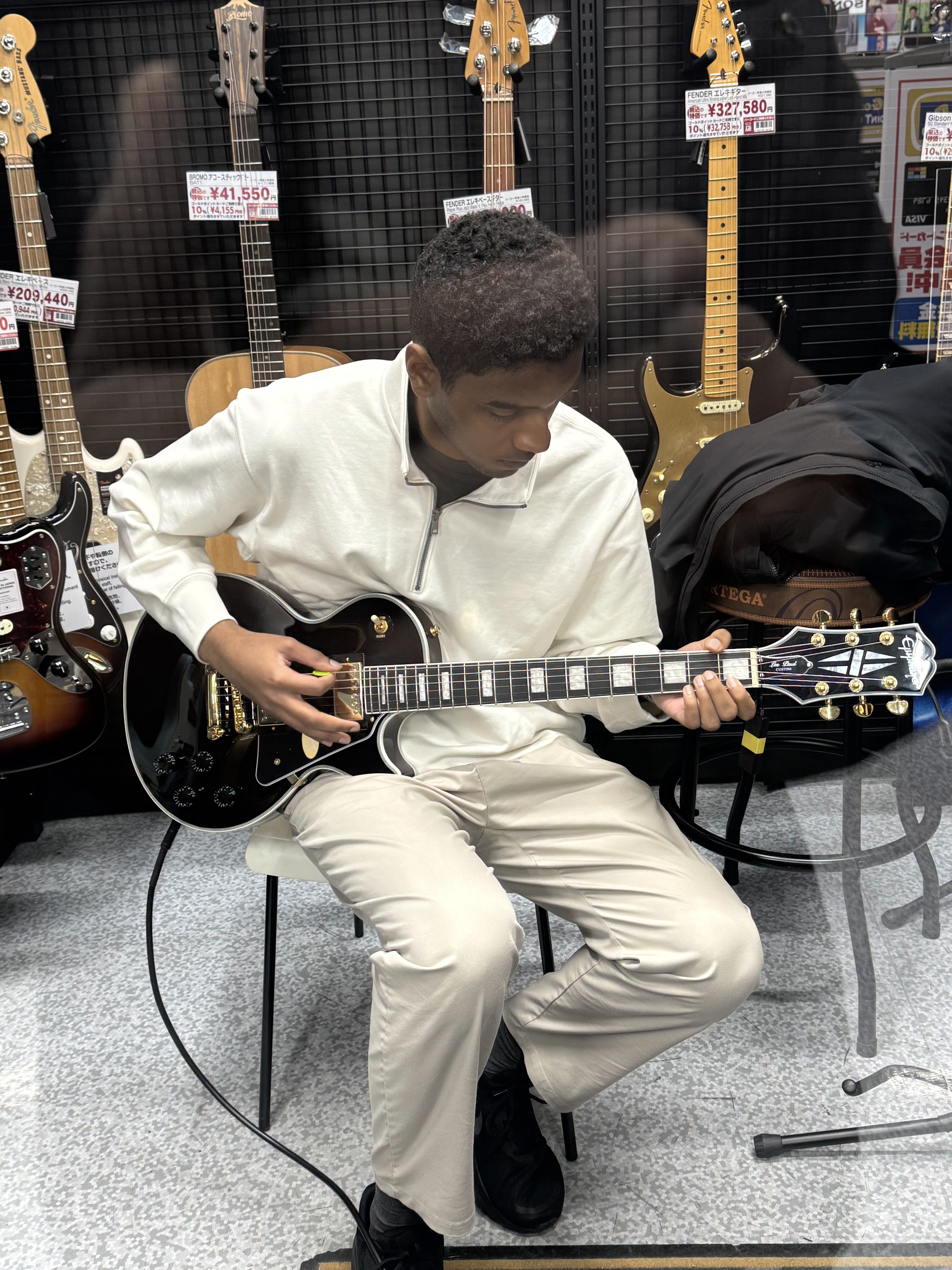 Nazario Taquidir Junior playing guitar